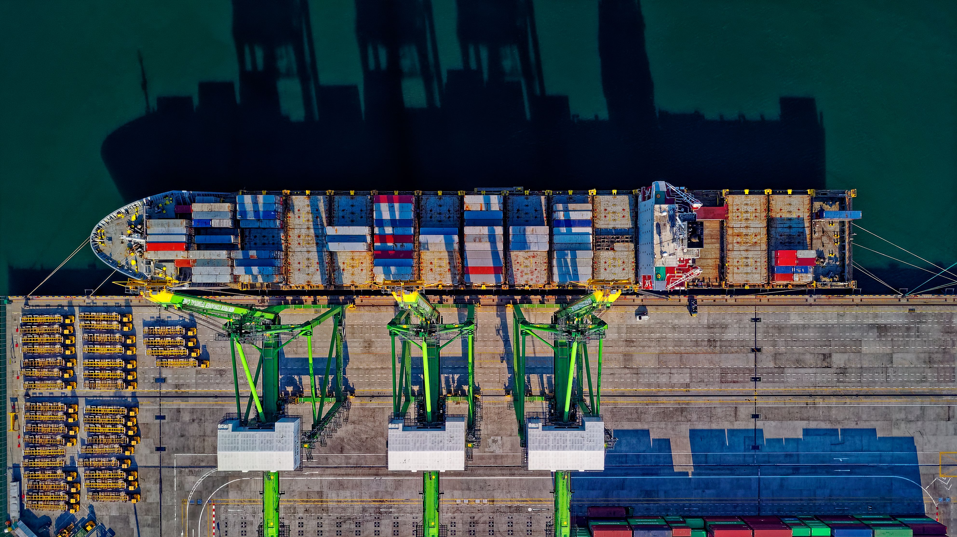 Container vessel and cranes at an international shipping port